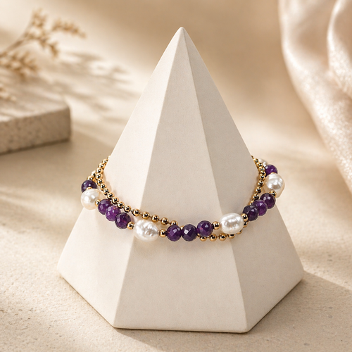 Amara pearl amethyst bracelet displayed on a white pyramid jewelry stand