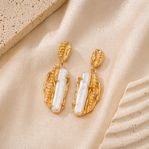 Auric pearl statement earrings with vintage gold sculptural details by CLINDE JADE